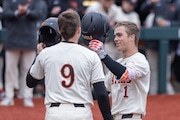 Oregon State’s Gavin Turley (#1) and Mason Guerra (#9) meet at home plate after Turley’s grand slam in the first inning as the Beavers face the Washington Huskies in a Pac-12 college baseball tournament at Goss Stadium in Corvallis on Saturday, March 23, 2024.