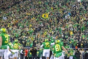 Oregon fans cheer after a touchdown by the No. 6 Ducks against the No. 16 Beavers in a college football game at Autzen Stadium in Eugene, Oregon on Saturday, Nov. 24, 2023.