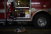 A "turnout" - gear set out to be readily available in the event of a call - rests on the floor near a fire vehicle at Portland Fire & Rescue Station 2 the morning of Mon., Jan. 1, 2024.