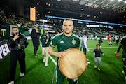 New Portland Timbers forward Jonathan Rodríguez holds a log slab after scoring the Timbers' lone goal in their 3-1 loss to the Philadelphia Union on Saturday, March 23, 2024, at Providence Park.