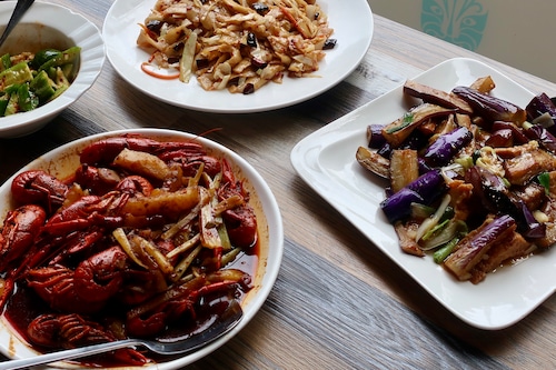 Crawfish in spicy sauce, hand-shaved noodles and stir-fried eggplant with tofu at Tasty Corner, a new restaurant near Portland State University.