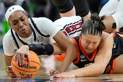 South Carolina guard Bree Hall, left, and Oregon State guard Talia von Oelhoffen (22) scramble for a loose ball during the first quarter of an Elite Eight round college basketball game during the NCAA Tournament, Sunday, March 31, 2024, in Albany, N.Y. (AP Photo/Mary Altaffer)