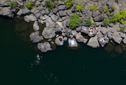 People gathered at High Rocks Park in Gladstone, OR, on June 25, 2021 to cool off in the Clackamas River as temperatures began to rise in what is anticipated to be a weekend of record-breaking heat.