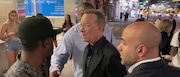 Tom Hanks, seen outside a New York restaurant, confronted fans who caused his wife Rita Wilson to trip on Wednesday, June 15. (YouTube)