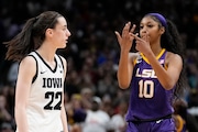 FILE -LSU's Angel Reese reacts in front of Iowa's Caitlin Clark during the second half of the NCAA Women's Final Four championship basketball game Sunday, April 2, 2023, in Dallas. LSU won 102-85 to win the championship. The national championship game in women's basketball last spring was unforgettable for a lot of good reasons.The game will also be remembered for its controversial officiating and The Associated Press has learned that an NCAA review concluded the refereeing did not meet expectations. (AP Photo/Tony Gutierrez, File)