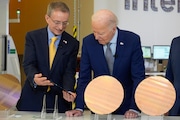 President Joe Biden and Intel CEO Pat Gelsinger inspect silicon wafers during a tour of the Intel campus Chandler, Ariz. on Wednesday.