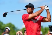 Tiger Woods follows his ball at the fourth tee during the last round of the Hero World Challenge at Albany Golf Club in Nassau, Bahamas, on Dec. 7, 2019. Woods is starting a new year with a new look. Just not a different color. Woods makes his 2024 debut this week in the Genesis Invitational at Riviera, a signature event on the PGA Tour in which he is the tournament host. The first order of business is unveiling what he referred to in December as the next “chapter.”