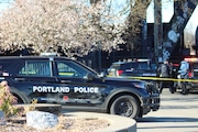 Police converged on Portland's waterfront path near the Steel Bridge on Friday, March 15, 2024, after a man was stabbed to death on the path in the early afternoon.