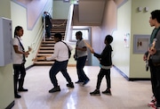 Bass guitar teacher David Shirkhani has his students walk around Boise-Eliot/Humboldt Elementary School while playing guitar. The goal of the exercise is loosening the students up while getting them comfortable with simultaneously moving and playing. February 12, 2024