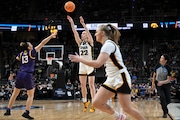 Iowa guard Caitlin Clark (22) puts up a three-point shot against LSU during the third quarter of an Elite Eight round college basketball game during the NCAA Tournament, Monday, April 1, 2024, in Albany, N.Y. (AP Photo/Hans Pennink)