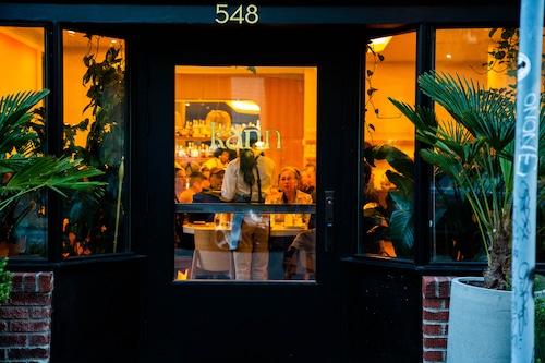 Dining room lit up seen from the street view in the evening