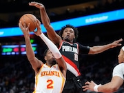 Atlanta Hawks guard Trent Forrest (2) goes up for a shot as Portland Trail Blazers Ashton Hagans (19) defends during the first half of an NBA basketball game Wednesday, March 27, 2024, in Atlanta. (AP Photo/John Bazemore) AP