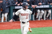 Oregon State’s Travis Bazzana motions to a teammate to head home as the Beavers face the Washington Huskies in a Pac-12 college baseball tournament at Goss Stadium in Corvallis on Saturday, March 23, 2024.