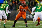 Taliese Fuaga #75 of the Oregon State Beavers blocks during a game against the Oregon Ducks at Autzen Stadium on November 24, 2023 in Eugene, Oregon. (Photo by Brandon Sloter/Image Of Sport/Getty Images)