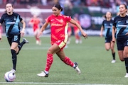 Portland Thorns forward Sophia Smith (#9) pushes the ball ahead during an NWSL match against NJ/NY Gotham FC at Providence Park on Sunday, March 24, 2024. 