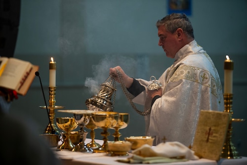 A preist performs a religious ritual