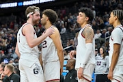 Gonzaga forward Drew Timme (left) hugs teammates while checking out of the game during the final minutes in the second half of an Elite 8 men's college basketball game against UConn in the West Region final of the NCAA Tournament, Saturday, March 25, 2023, in Las Vegas. (AP Photo/David Becker)