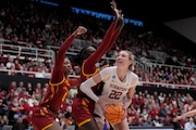 Stanford forward Cameron Brink (22) looks to shoot against Iowa State center Isnelle Natabou, left, and forward Nyamer Diew during the first half of a second-round college basketball game in the women's NCAA Tournament in Stanford, Calif., Sunday, March 24, 2024. (AP Photo/Jeff Chiu)