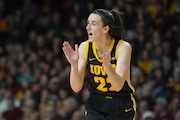 Iowa guard Caitlin Clark (22) claps during the second half of an NCAA college basketball game against Minnesota, Wednesday, Feb. 28, 2024, in Minneapolis. (AP Photo/Abbie Parr)