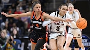 Oregon State guard Donovyn Hunter (4) and South Carolina guard Tessa Johnson (5) chase down a loose ball during the second quarter of an Elite Eight round college basketball game during the NCAA Tournament, Sunday, March 31, 2024, in Albany, N.Y. (AP Photo/Hans Pennink)