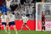 United States' Sophia Smith, center, celebrates after scoring a goal during overtime in a CONCACAF Gold Cup women's soccer tournament semifinal match against Canada, Wednesday, March 6, 2024, in San Diego. (AP Photo/Gregory Bull)