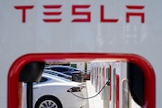 Tesla vehicles charge at a station in Emeryville, Calif., Wednesday, Aug. 10, 2022. Tesla's stock is faltering before the market open on Thursday as the electric vehicle, solar panel and battery maker cautioned on slower sales growth this year and posted weaker-than-expected quarterly earnings.