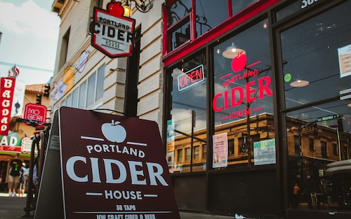 The outside of a cider taproom with a sign that reads Portland Cider House.