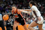 Oregon State guard Talia von Oelhoffen (22) drives against South Carolina guard Tessa Johnson (5) during the third quarter of an Elite Eight round college basketball game during the NCAA Tournament, Sunday, March 31, 2024, in Albany, N.Y. (AP Photo/Mary Altaffer)