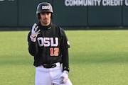 Oregon State’s Micah McDowell (12) looks on as the Beavers face Coppin State Eagles in a nonconference college baseball game on Saturday, Feb. 25, 2023, at Goss Stadium in Corvallis. Oregon State won 16-0.