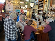 Customers congregate around the bar at Northwood Public House & Brewery in Battle Ground. The pub on Saturday, March 9, 2024, invites the public to its 10th anniversary celebration.